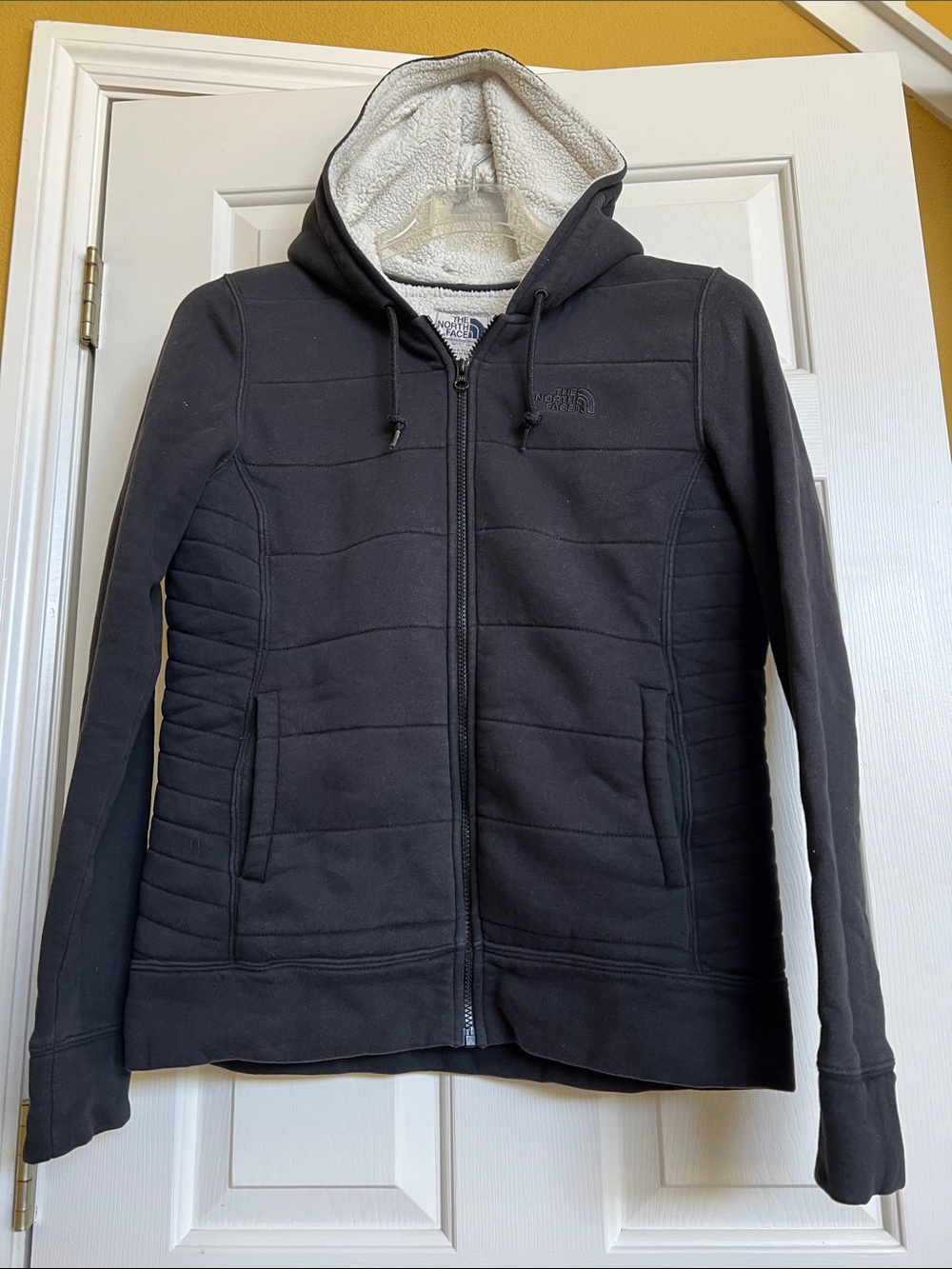 The North Face hooded jacket
 ( Quilted fabric )